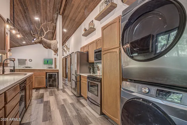 a kitchen with a stove a washer and dryer