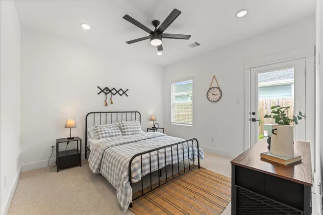 a bathroom with a sink mirror and toilet