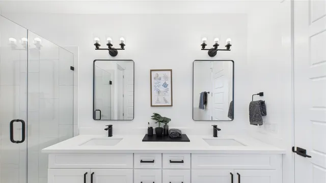 a bathroom with a double vanity sink a mirror a vanity and