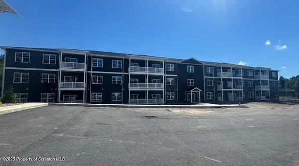 a front view of residential houses with yard