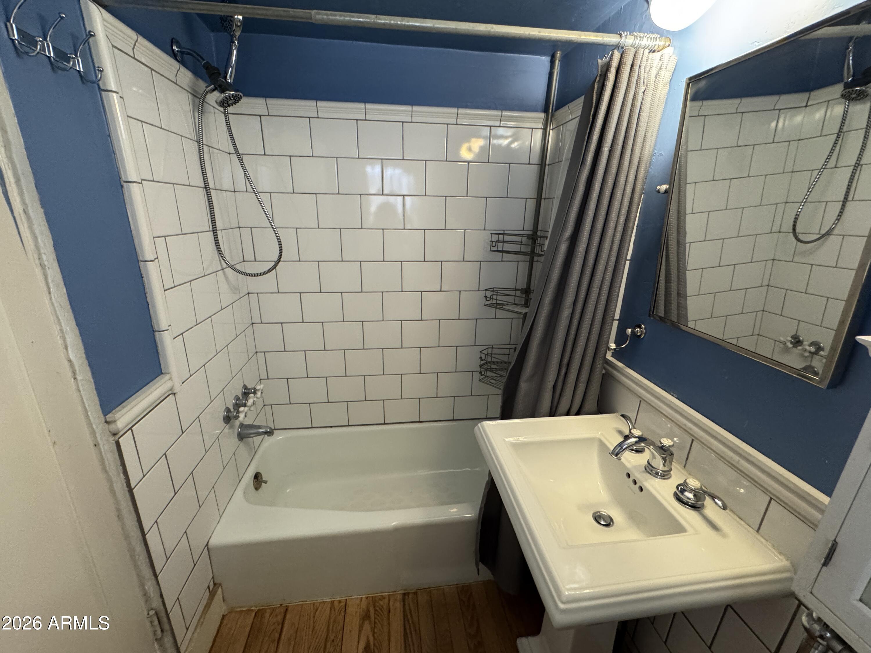 505 West Granada Road Phoenix, AZ 85003 - Photo 11 of 30 a bathroom with a sink and a bathtub