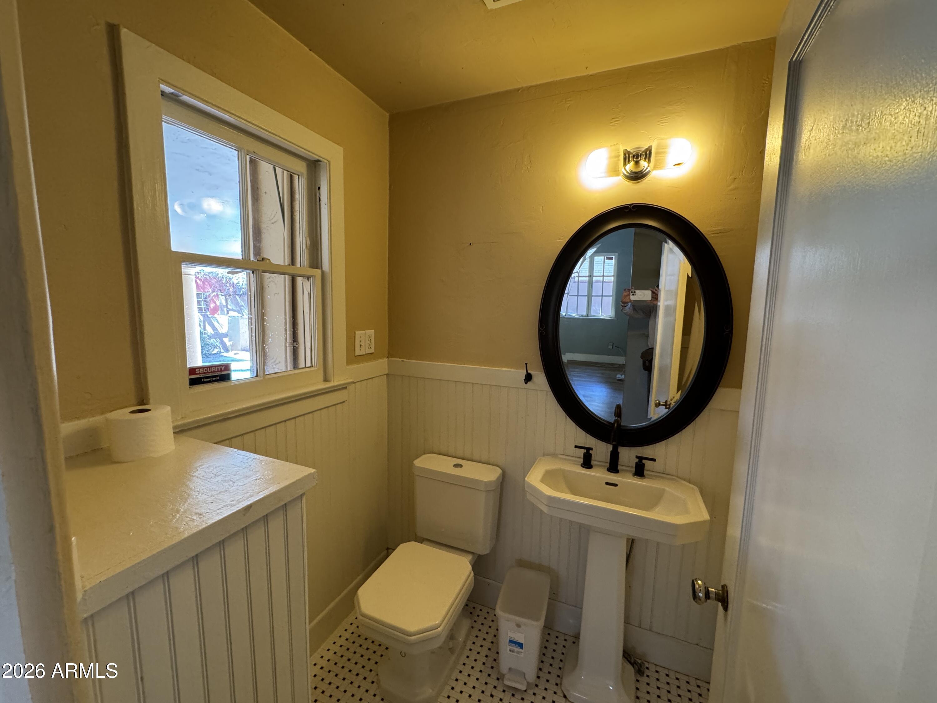 505 West Granada Road Phoenix, AZ 85003 - Photo 15 of 30 a bathroom with a toilet sink and mirror