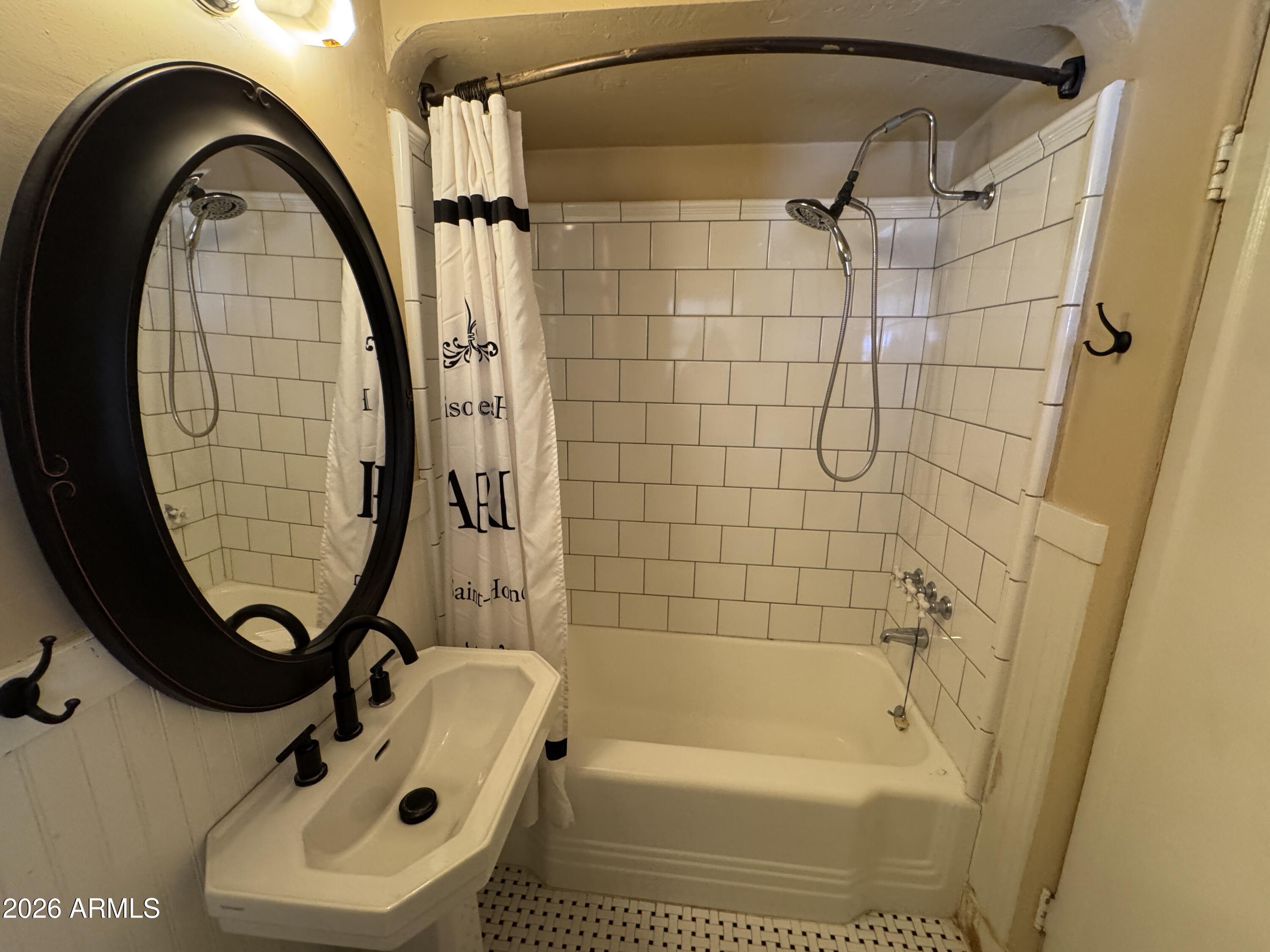 505 West Granada Road Phoenix, AZ 85003 - Photo 16 of 30 a bathroom with a sink a toilet and a mirror