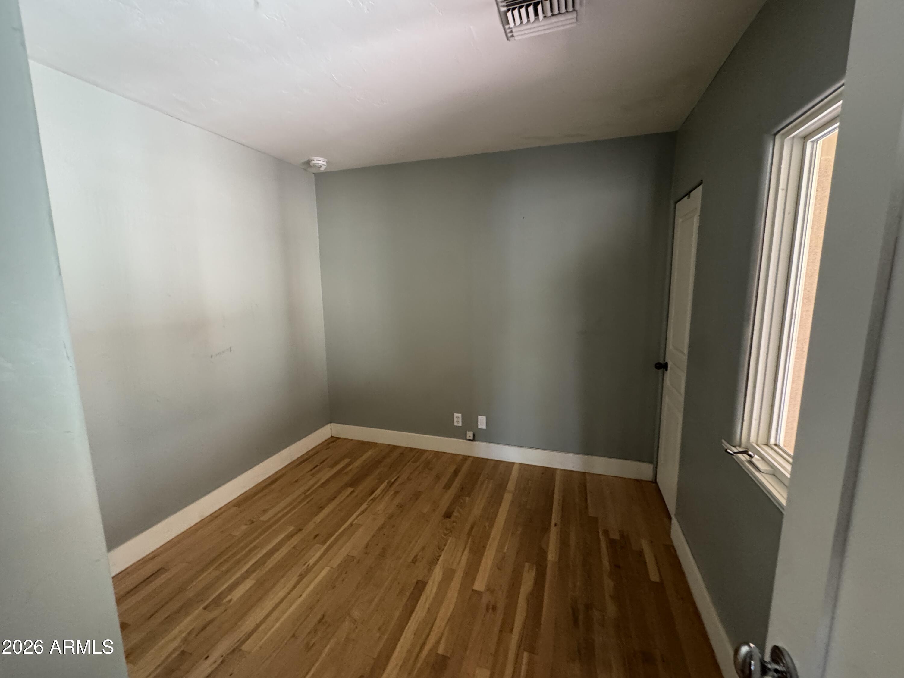 505 West Granada Road Phoenix, AZ 85003 - Photo 18 of 30 a view of wooden floor in an empty room