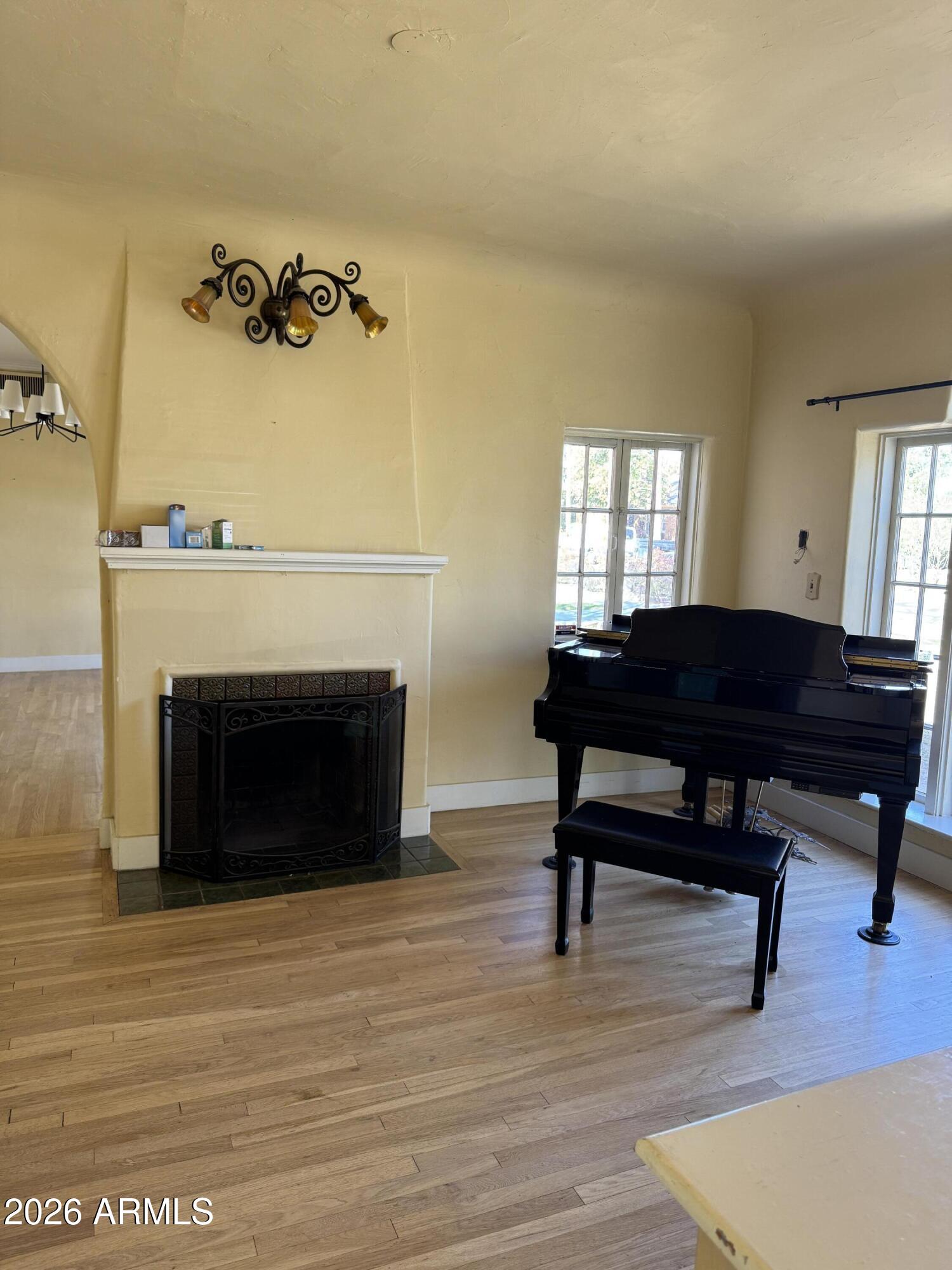 505 West Granada Road Phoenix, AZ 85003 - Photo 2 of 30 a living room with furniture a fireplace and a fireplace