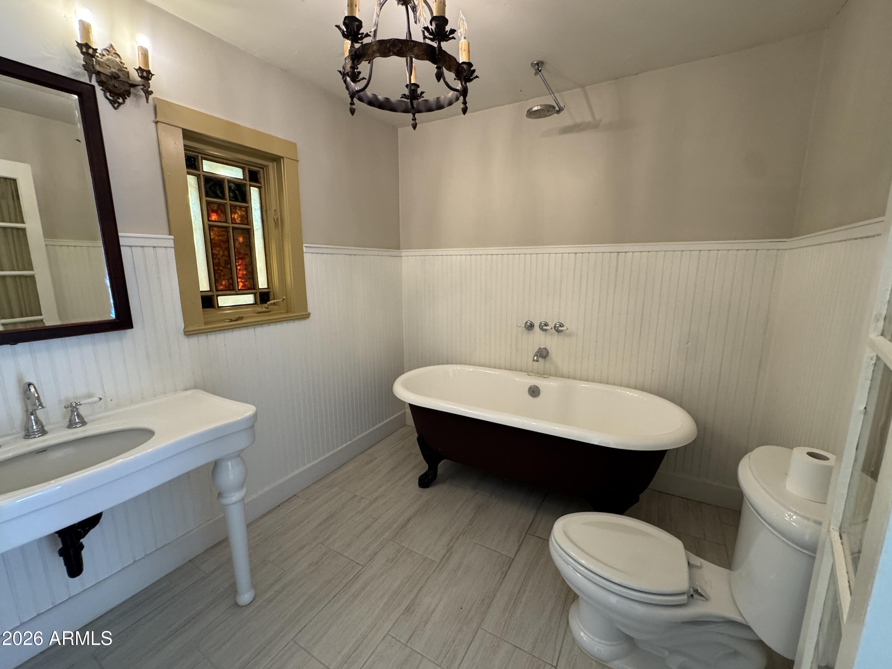 505 West Granada Road Phoenix, AZ 85003 - Photo 21 of 30 a bathroom with a toilet a sink and mirror