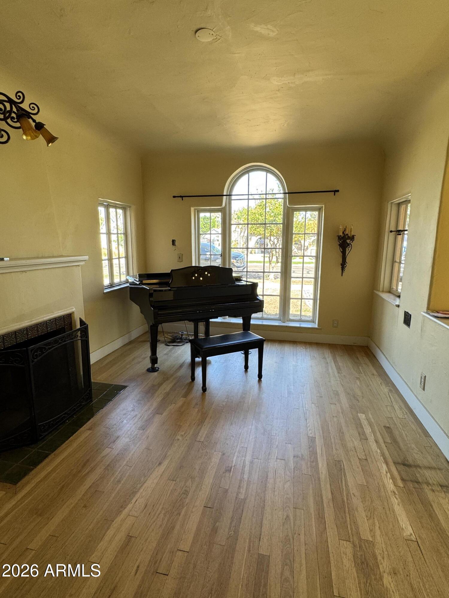 505 West Granada Road Phoenix, AZ 85003 - Photo 3 of 30 a living room with furniture and a wooden floor