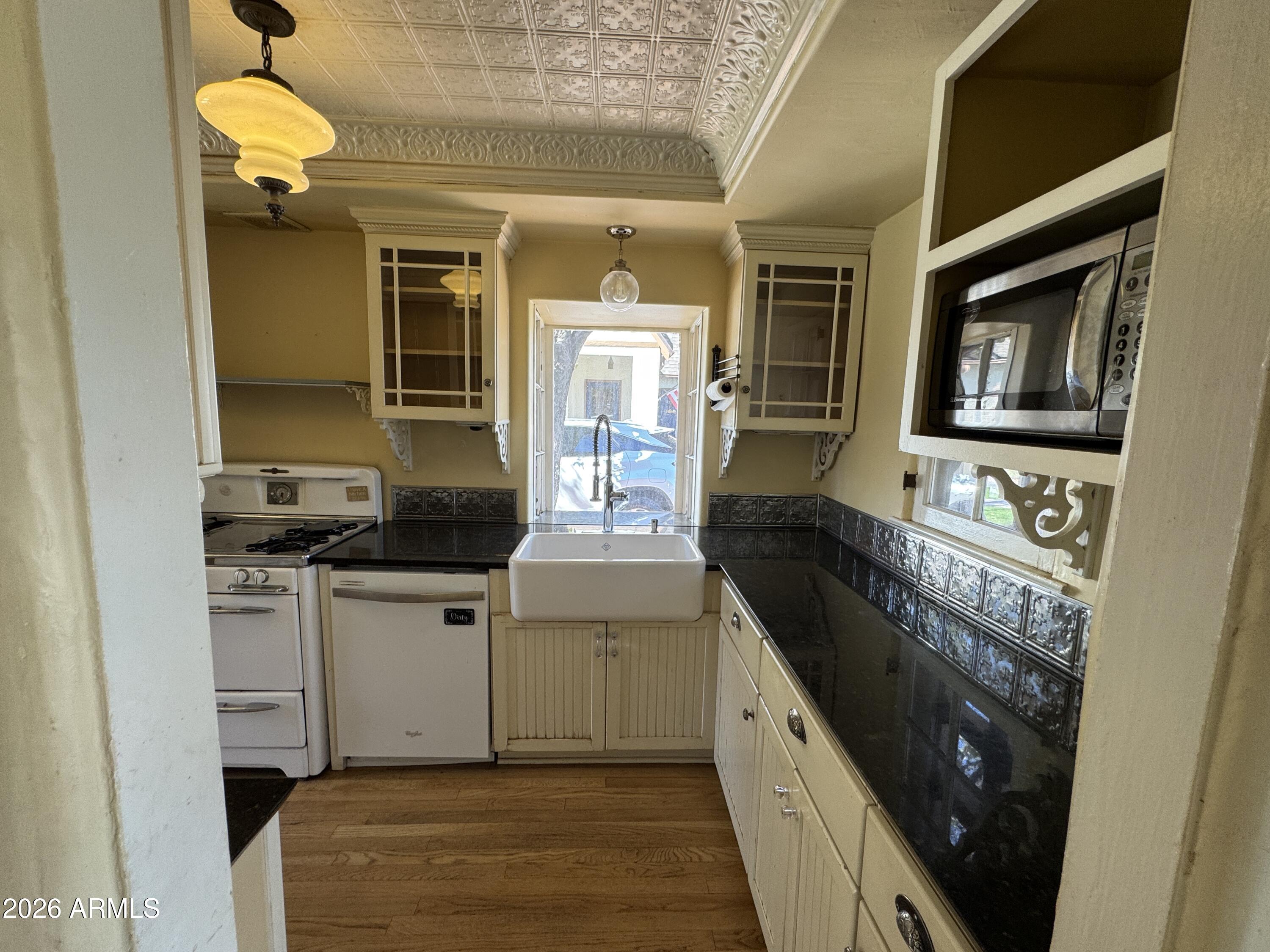 505 West Granada Road Phoenix, AZ 85003 - Photo 5 of 30 a kitchen with stainless steel appliances granite countertop a stove and a refrigerator