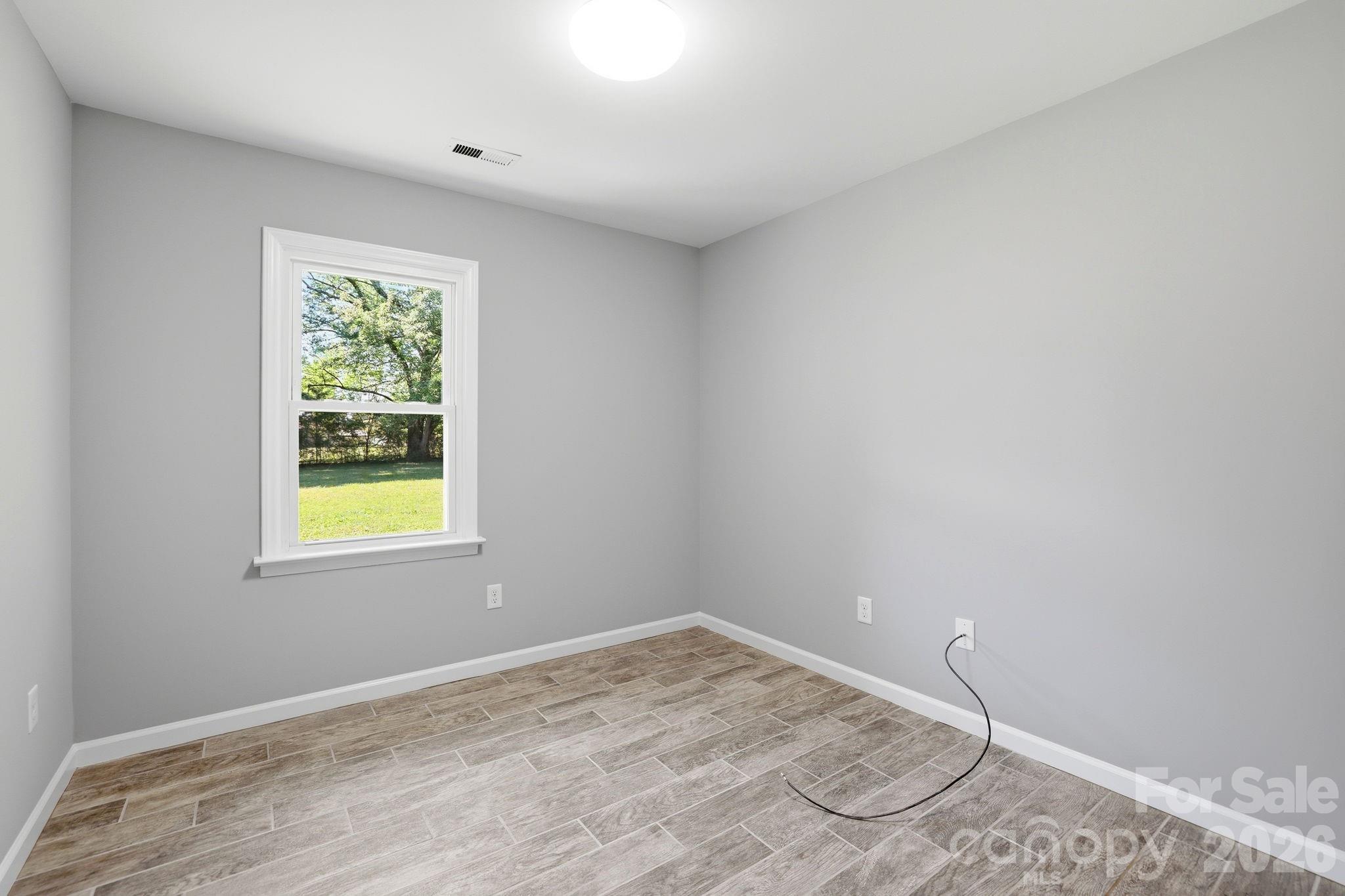 1108 Willoughby Road Monroe, NC 28110 - Photo 4 of 48 an empty room with a window