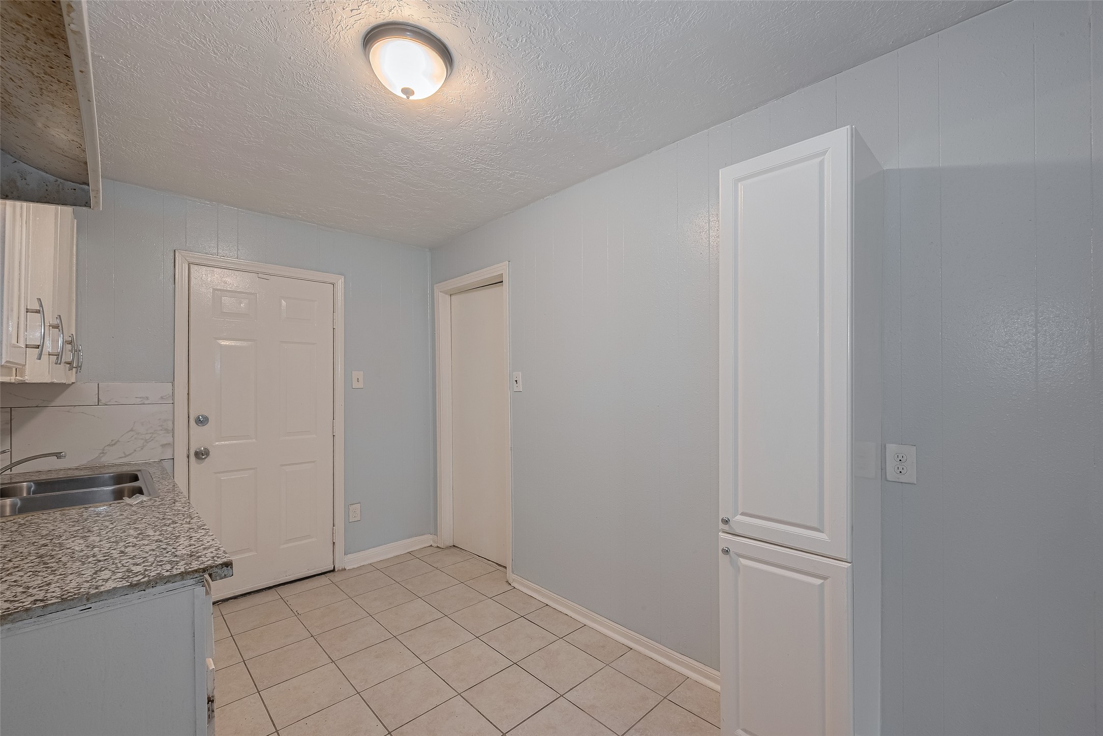4906 Larkspur Street Houston, TX 77033 - Photo 5 of 14 a view of a storage & utility room in a house
