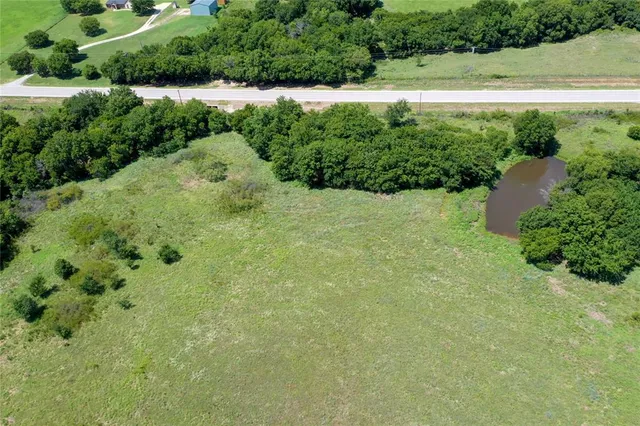 a view of a garden with a building