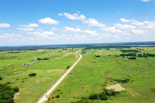 a view of a golf course with a lake