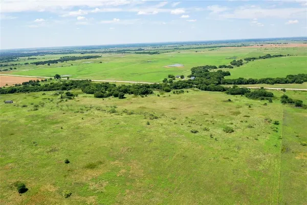 a view of field with ocean view