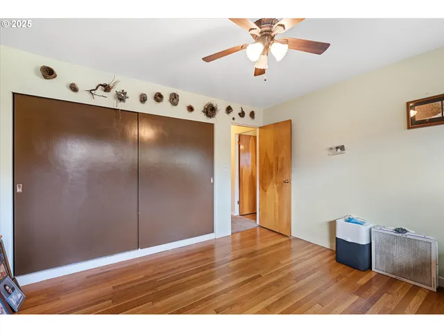 a room with a wooden floor and furniture