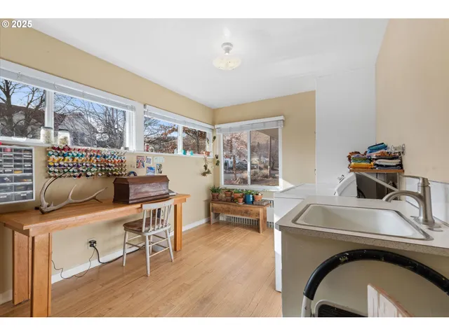 a living room with a couch and dresser