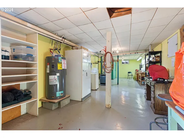 a view of parking garage with cars parked