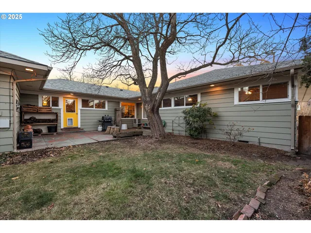 a view of a house with large windows