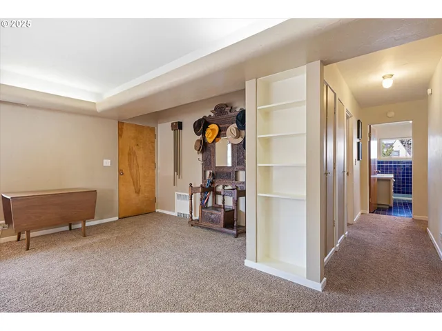 a view of a livingroom with a furniture and closet