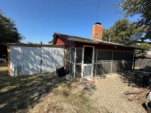 a house view with a backyard space