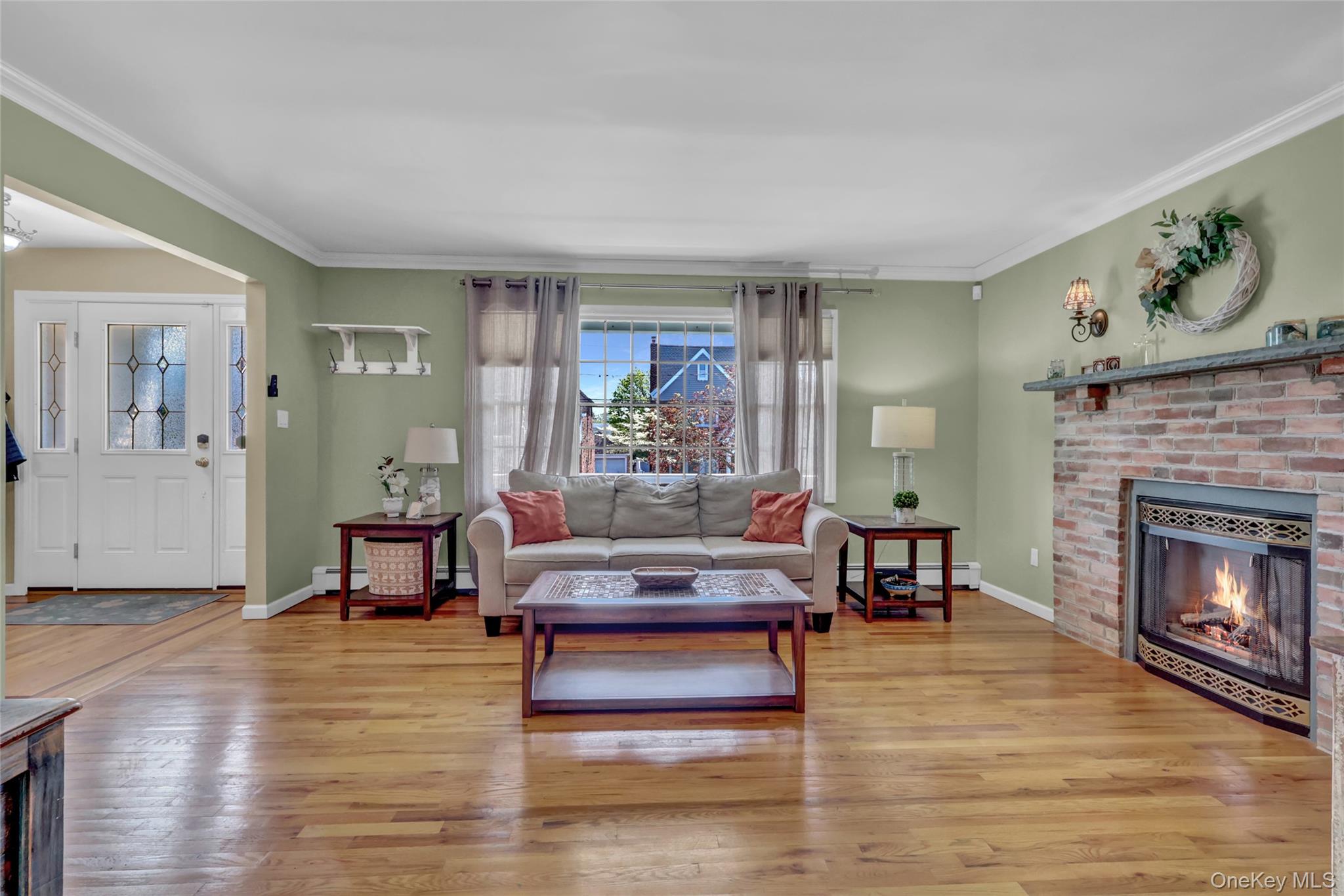 18 Hampton Road Lynbrook, NY 11563 - Photo 12 of 37 a living room with furniture and a fireplace