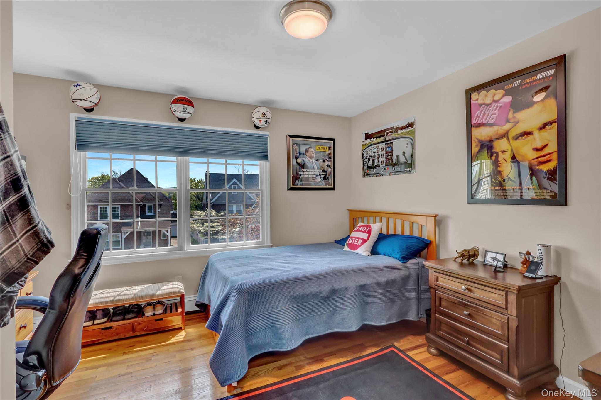 18 Hampton Road Lynbrook, NY 11563 - Photo 30 of 37 a bedroom with furniture and a flat screen tv