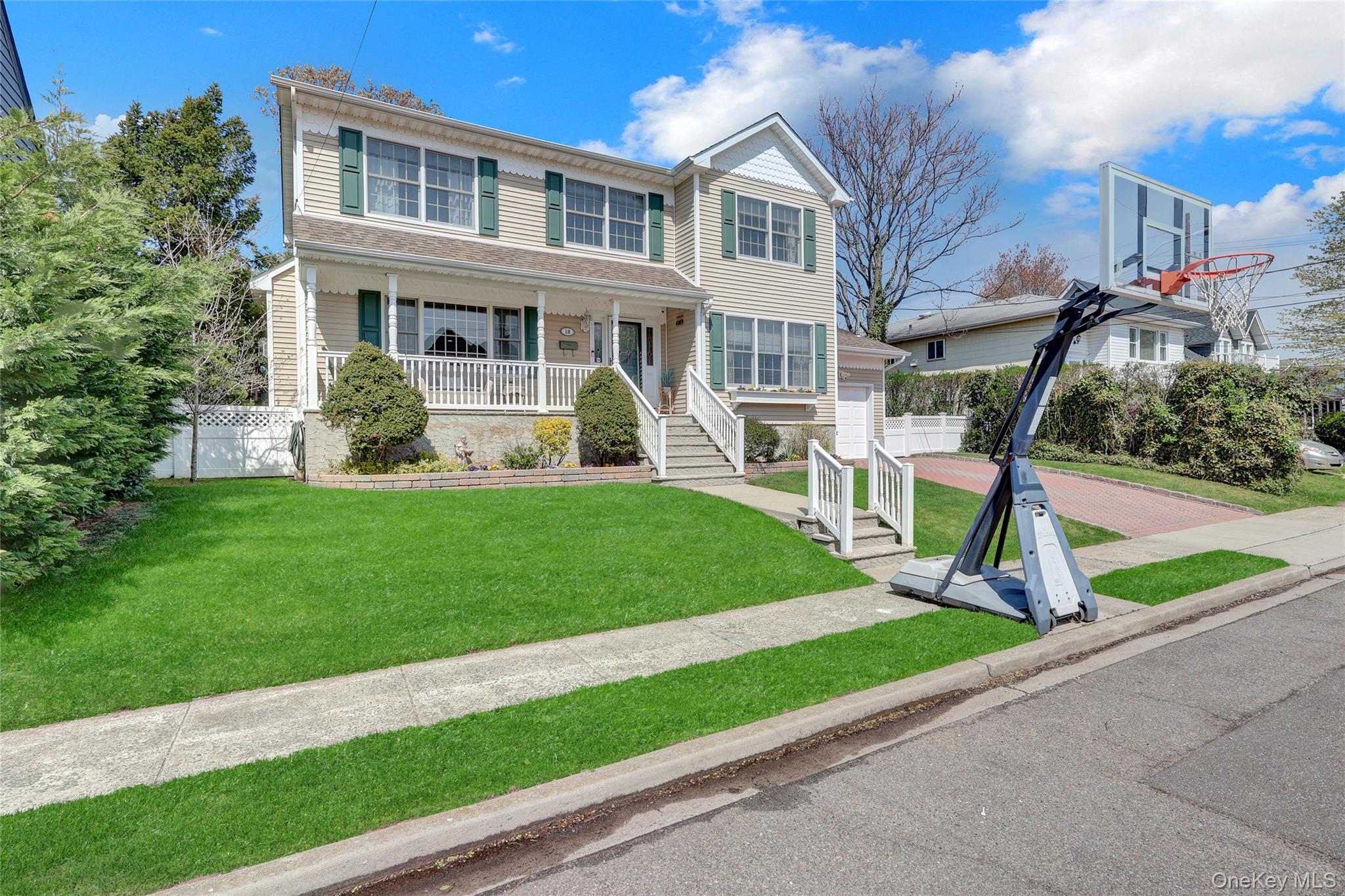 18 Hampton Road Lynbrook, NY 11563 - Photo 3 of 37 a view of a house with a yard and plants
