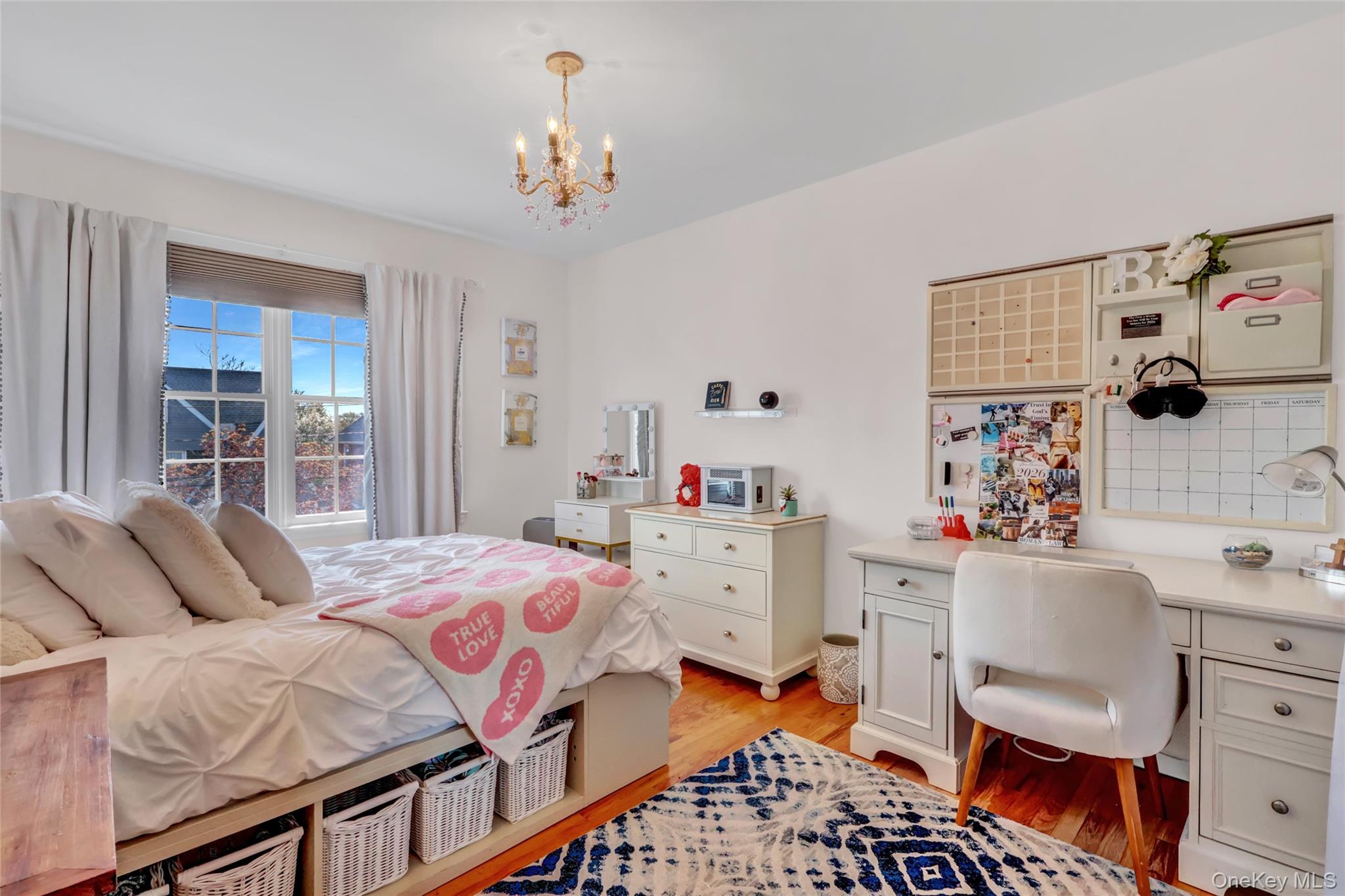 18 Hampton Road Lynbrook, NY 11563 - Photo 31 of 37 a bedroom with a bed and a window