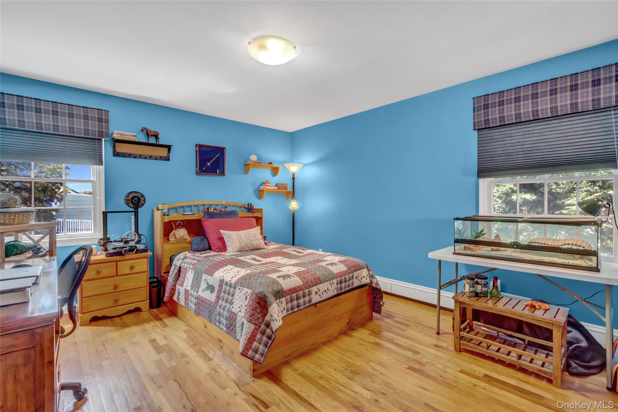 18 Hampton Road Lynbrook, NY 11563 - Photo 32 of 37 a bedroom with a bed and a window