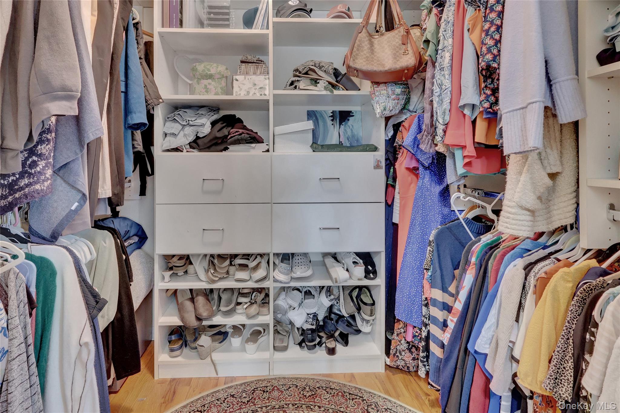 18 Hampton Road Lynbrook, NY 11563 - Photo 33 of 37 a view of walk in closet with clothes and shoes