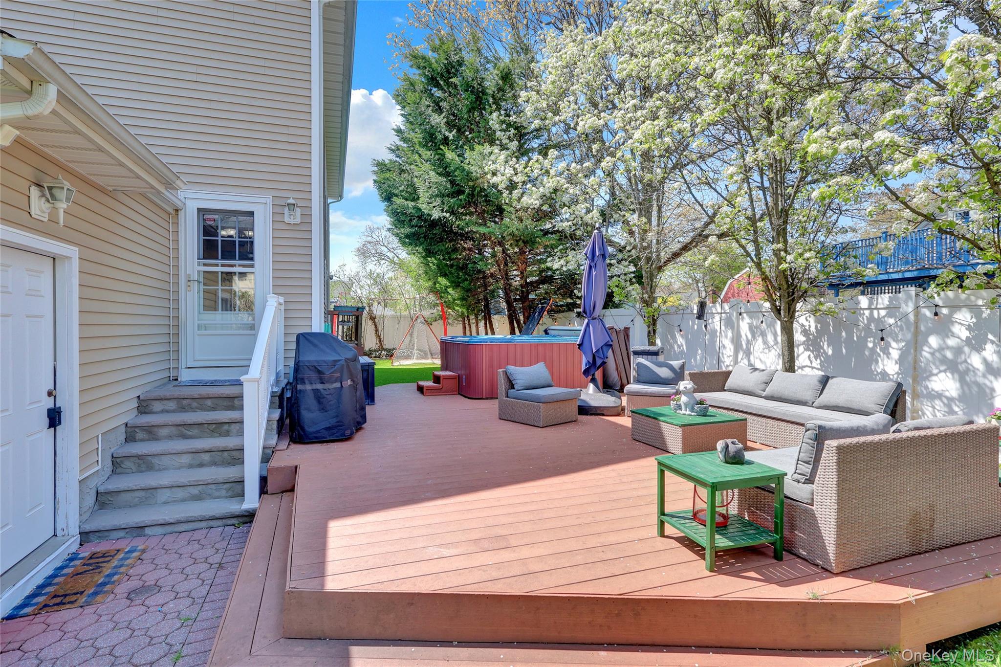 18 Hampton Road Lynbrook, NY 11563 - Photo 34 of 37 a view of a backyard with sitting area