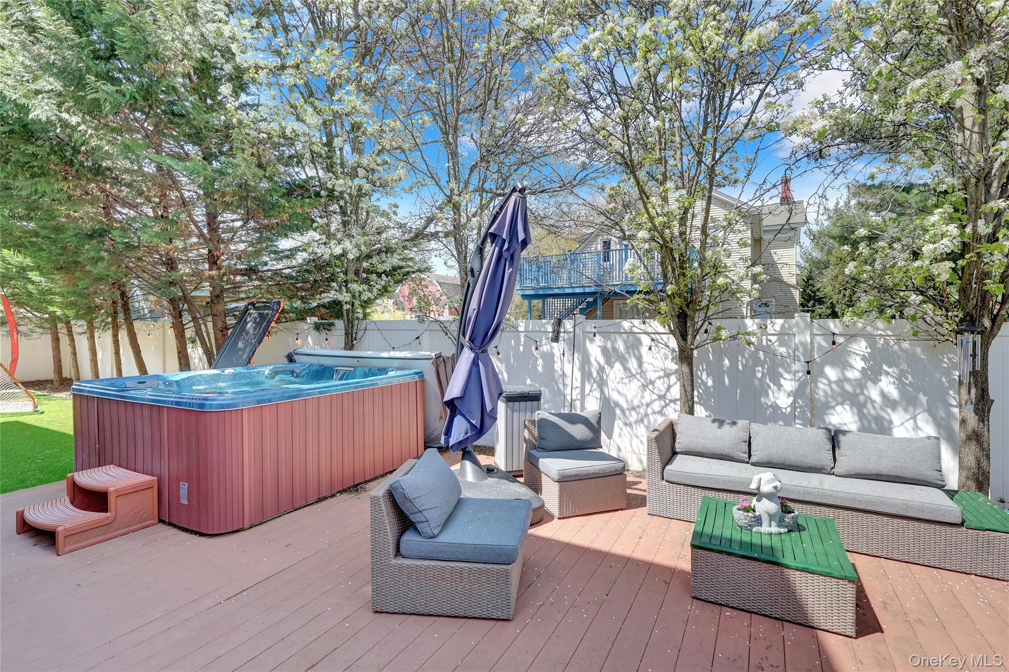 18 Hampton Road Lynbrook, NY 11563 - Photo 35 of 37 a view of outdoor sitting area with furniture and wooden tub