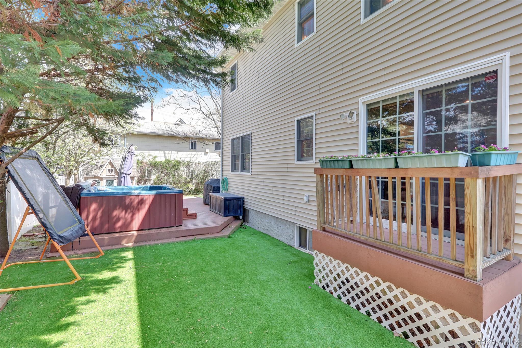 18 Hampton Road Lynbrook, NY 11563 - Photo 37 of 37 a view of a house with a yard and furniture