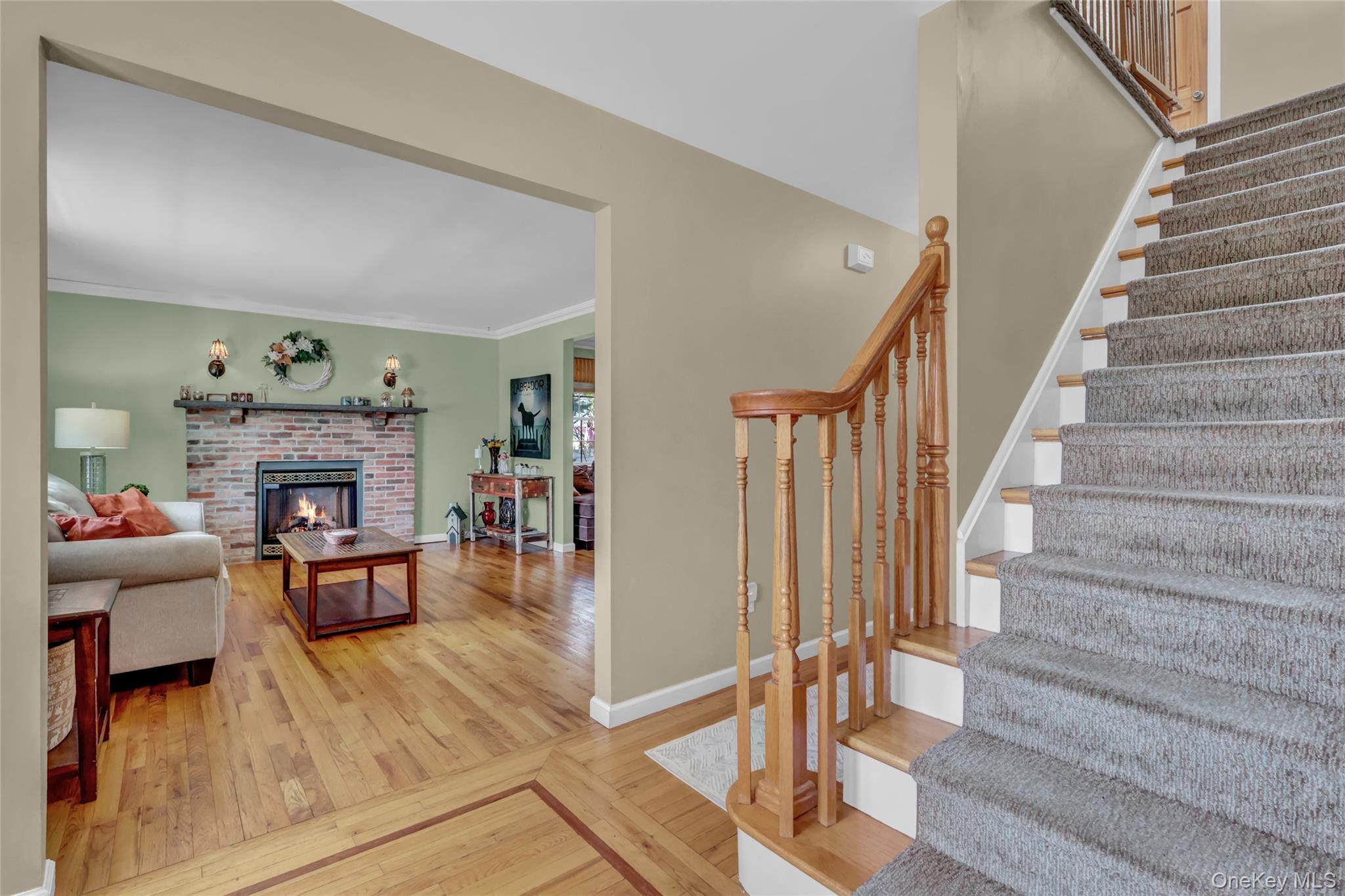 18 Hampton Road Lynbrook, NY 11563 - Photo 5 of 37 a living room with furniture and a fireplace