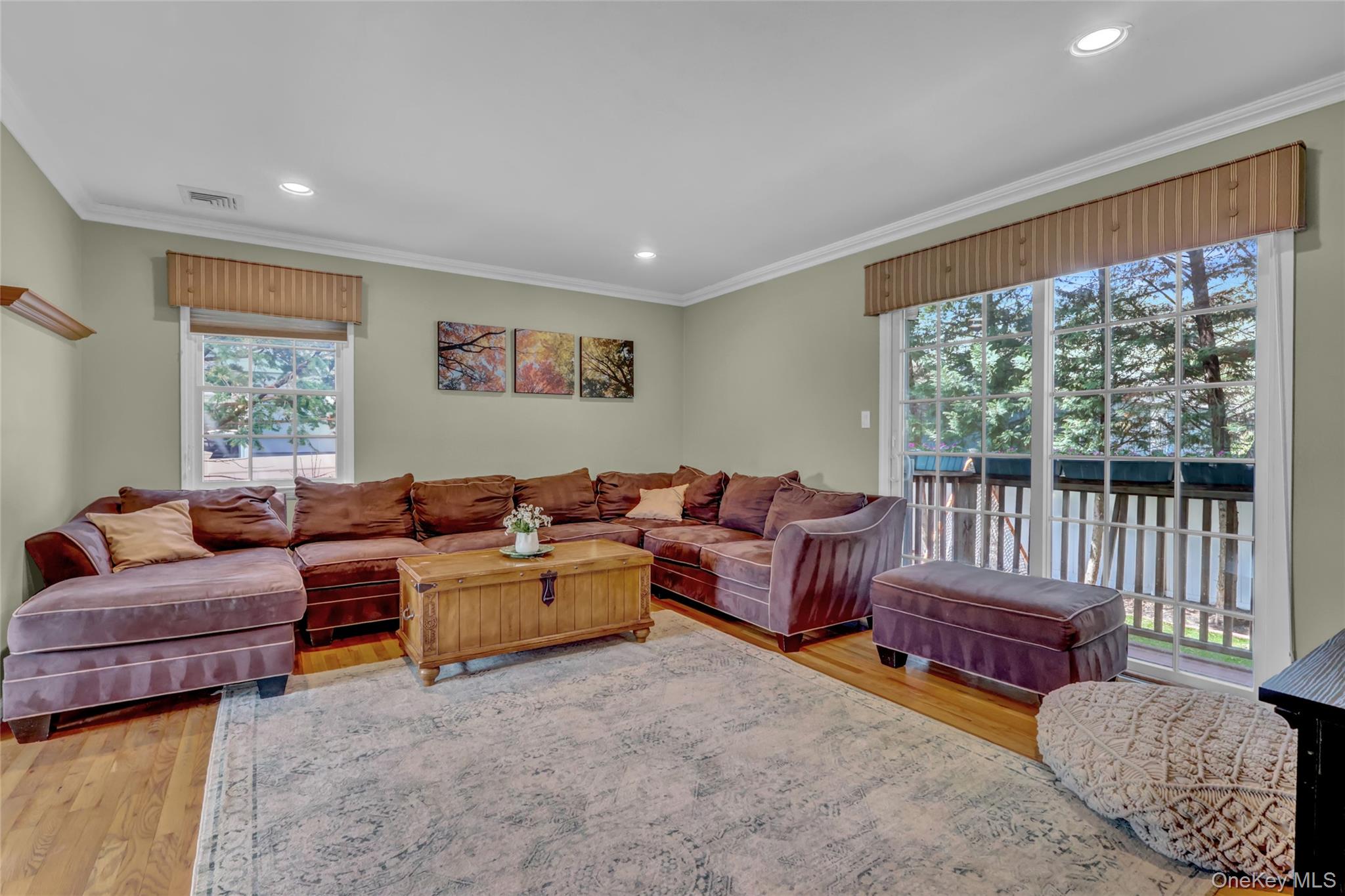 18 Hampton Road Lynbrook, NY 11563 - Photo 10 of 37 a living room with furniture and a large window