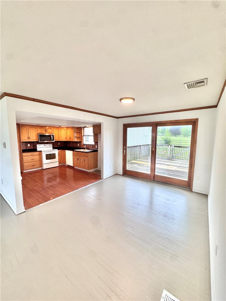 8325 Schantz Road Breinigsville, PA 18031 - Photo 6 of 21 Functional kitchen flows into a dining area with direct outdoor access.