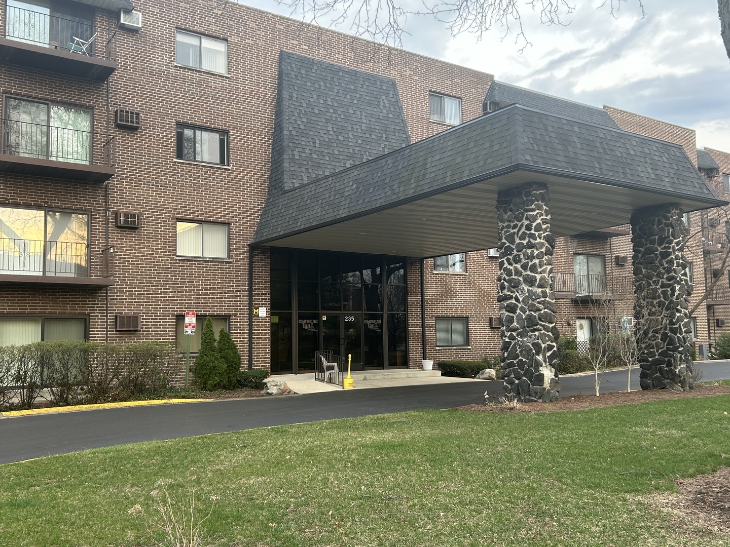 235 North Mill Road, Unit 114B Addison, IL 60101 - Photo 1 of 28 a view of a building with a garden