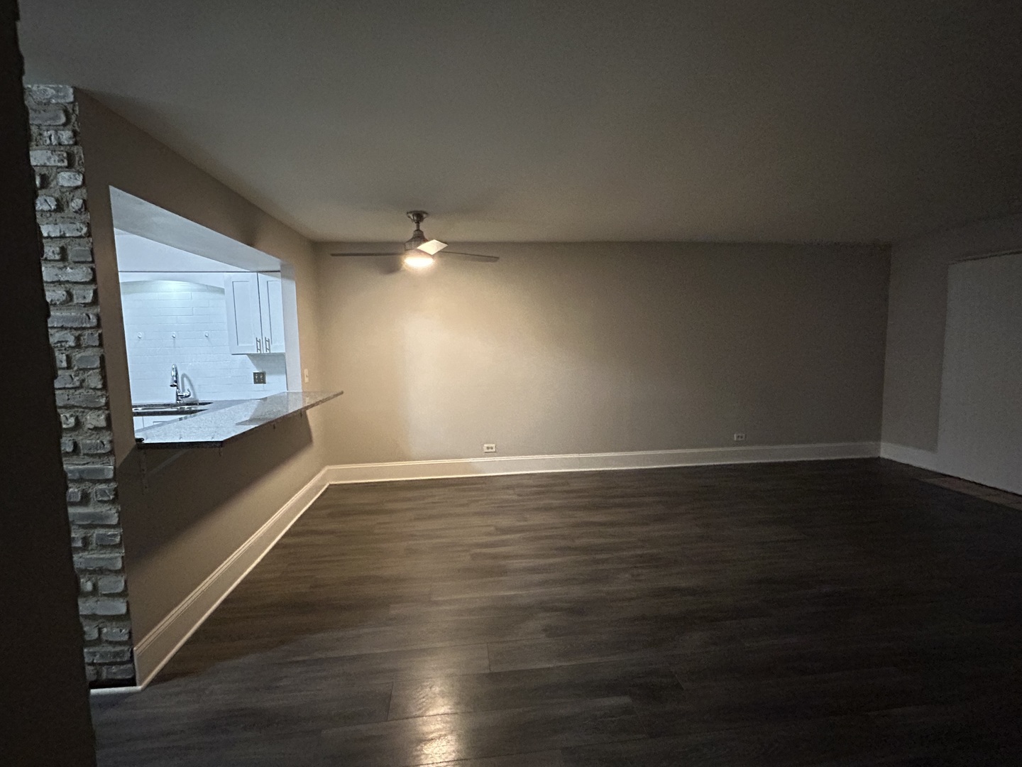 235 North Mill Road, Unit 114B Addison, IL 60101 - Photo 10 of 28 a view of kitchen and hall with wooden floor