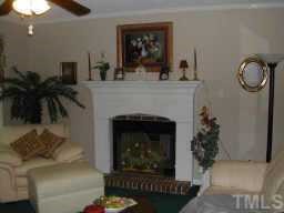 1035 Clayton Road Benson, NC 27504 - Photo 2 of 7 a living room with furniture and a fireplace