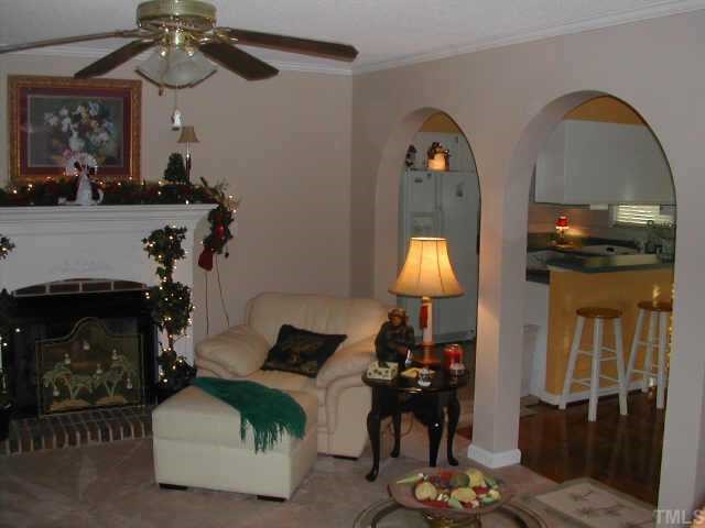 1035 Clayton Road Benson, NC 27504 - Photo 3 of 7 a living room with furniture and a fireplace