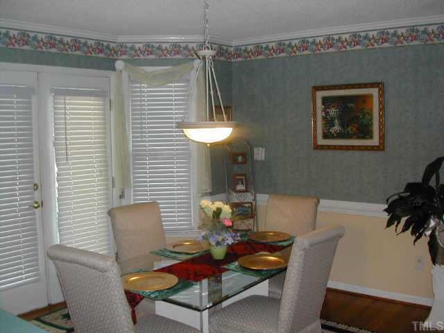 1035 Clayton Road Benson, NC 27504 - Photo 4 of 7 a view of a dining room with furniture and chandelier