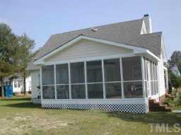1035 Clayton Road Benson, NC 27504 - Photo 5 of 7 a front view of a house with a yard