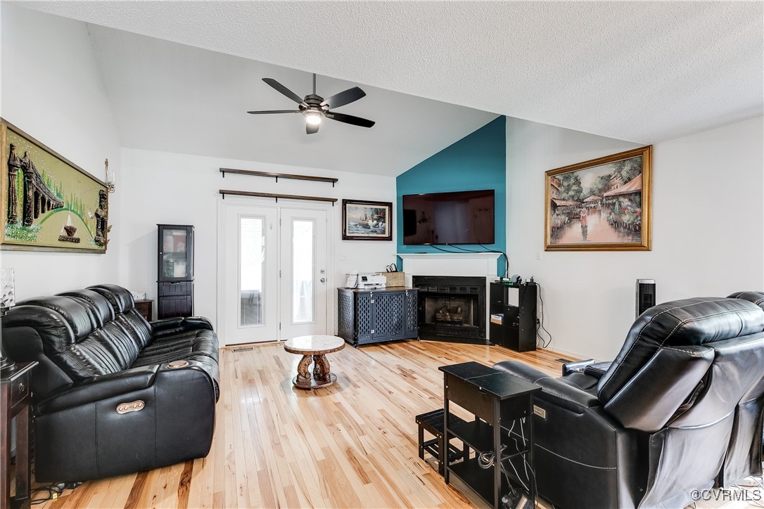 3003 Chartwood Drive Sandston, VA 23150 - Photo 11 of 29 a living room with furniture and a flat screen tv with wooden floor