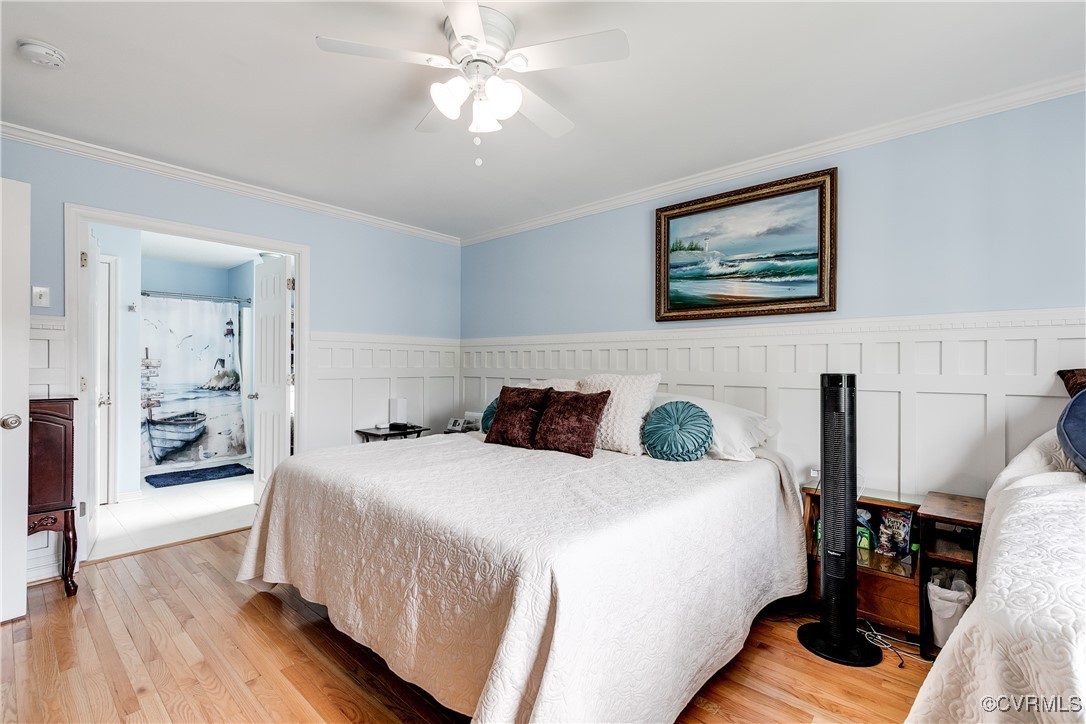 3003 Chartwood Drive Sandston, VA 23150 - Photo 15 of 29 a bedroom with a bed and wooden floor