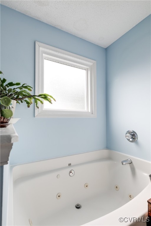 3003 Chartwood Drive Sandston, VA 23150 - Photo 18 of 29 a bathroom with a bathtub and a window