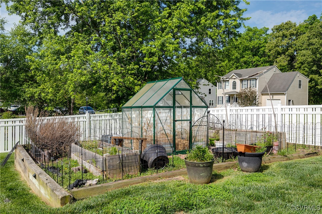 3003 Chartwood Drive Sandston, VA 23150 - Photo 24 of 29 a view of a chair and table in backyard