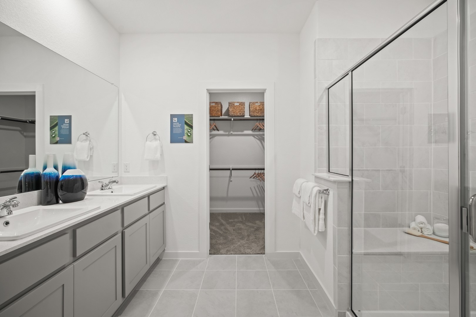 194 Hornet Street Elgin, TX 78621 - Photo 18 of 40 a bathroom with a double vanity sink a toilet and shower