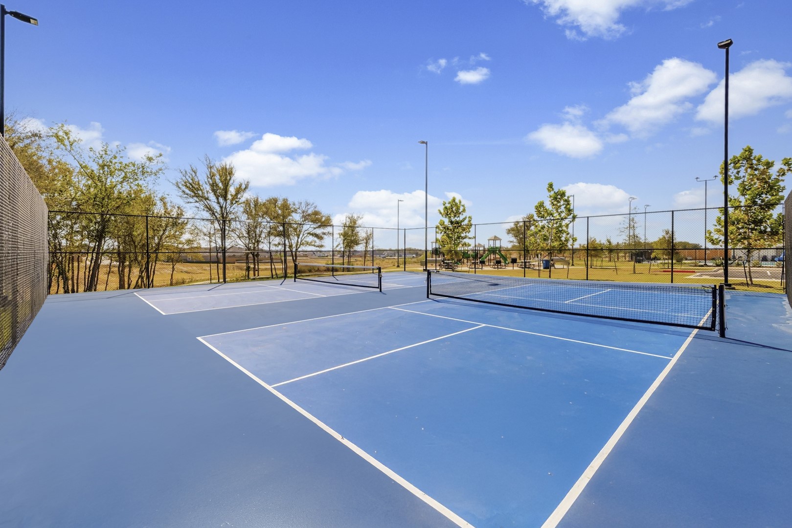 194 Hornet Street Elgin, TX 78621 - Photo 35 of 40 a view of a tennis court