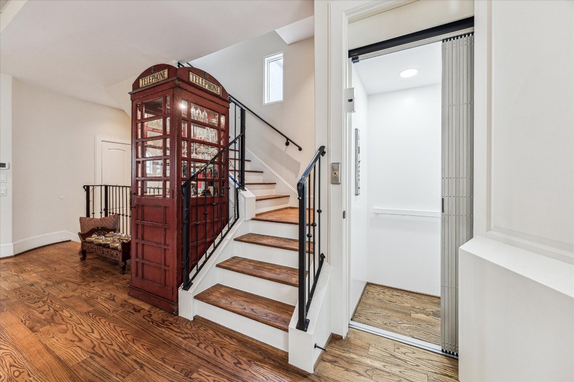 5213 Feagan Street, Unit A Houston, TX 77007 - Photo 23 of 47 a view of a hallway with wooden floor and staircase