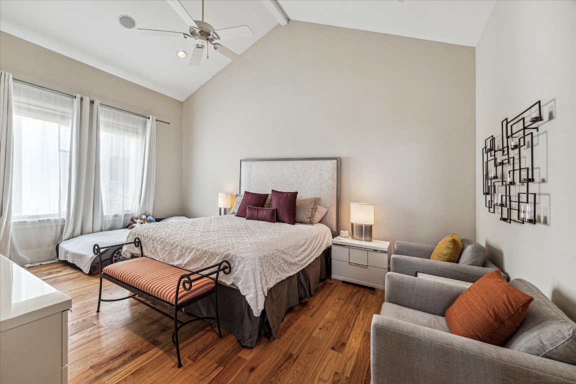 5213 Feagan Street, Unit A Houston, TX 77007 - Photo 24 of 47 a bedroom with a bed and wooden floor