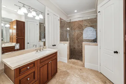 a bathroom with a sink double vanity and a mirror